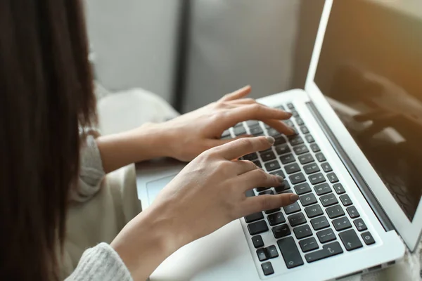 Beautiful young woman using laptop at home, closeup — Stock Photo, Image