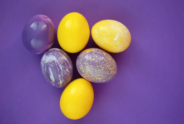 Painted Easter eggs on color background — Stock Photo, Image