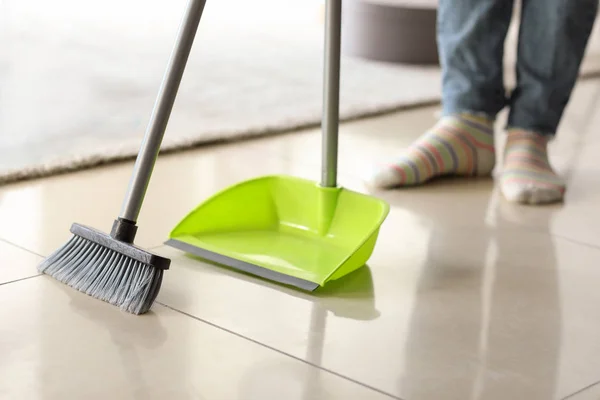 Beautiful woman cleaning floor at home — Stock Photo, Image