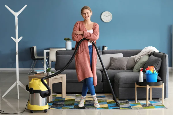 Beautiful woman with vacuum cleaner at home — Stock Photo, Image