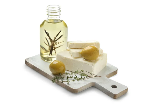 Board with tasty feta cheese and olive oil on white background — Stock Photo, Image