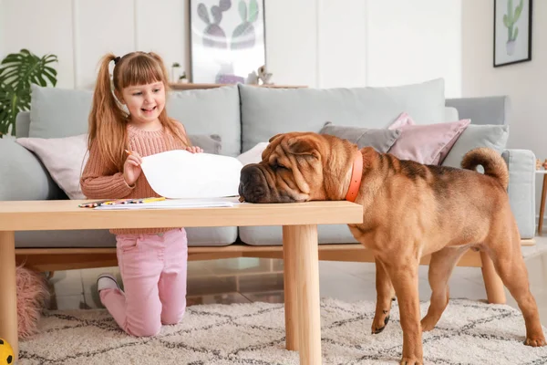 Cute little girl with funny dog at home — Stock Photo, Image