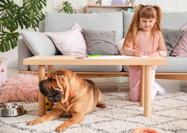 Cute little girl with funny dog at home — Stock Photo, Image