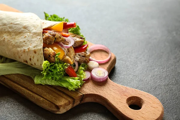 Tasty doner kebab on wooden board — Stock Photo, Image