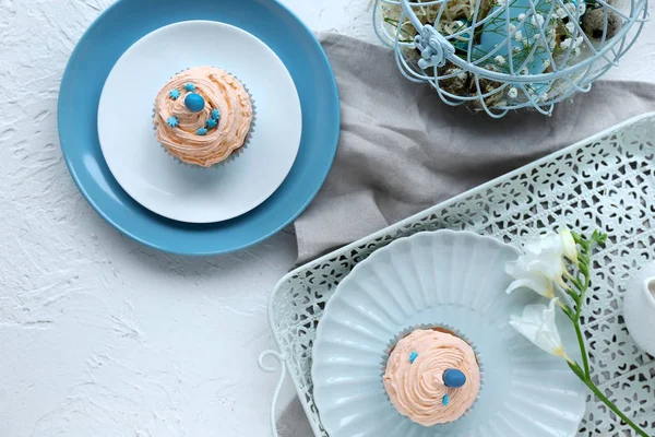 Tasty Easter cupcakes on white table — Stock Photo, Image