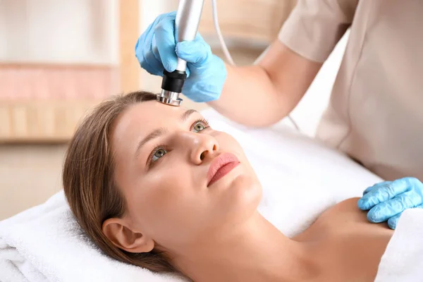 Young woman undergoing procedure of rf lifting in beauty salon — Stock Photo, Image