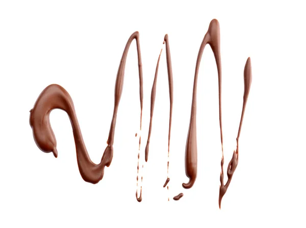 Chocolate derretido derramado sobre fondo blanco — Foto de Stock