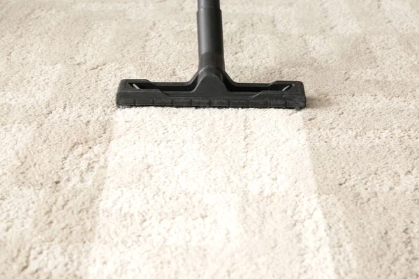 Brush of vacuum cleaner on carpet — Stock Photo, Image