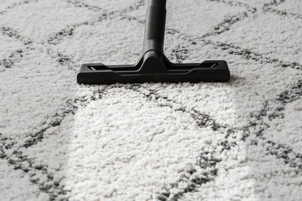 Brush of vacuum cleaner on carpet — Stock Photo, Image