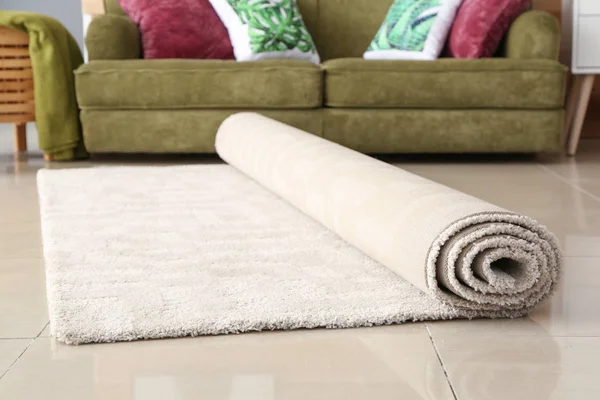 Rolled carpet on floor in room — Stock Photo, Image