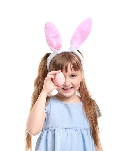 Cute little girl with Easter egg and bunny ears on white background — Stock Photo, Image