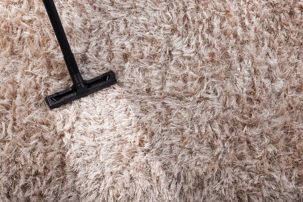 Brush of vacuum cleaner on carpet — Stock Photo, Image