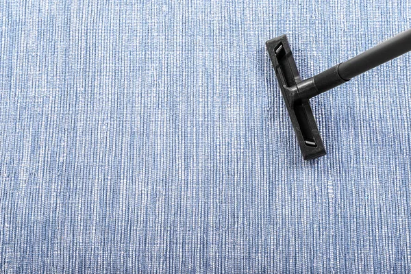 Escova de aspirador no tapete — Fotografia de Stock
