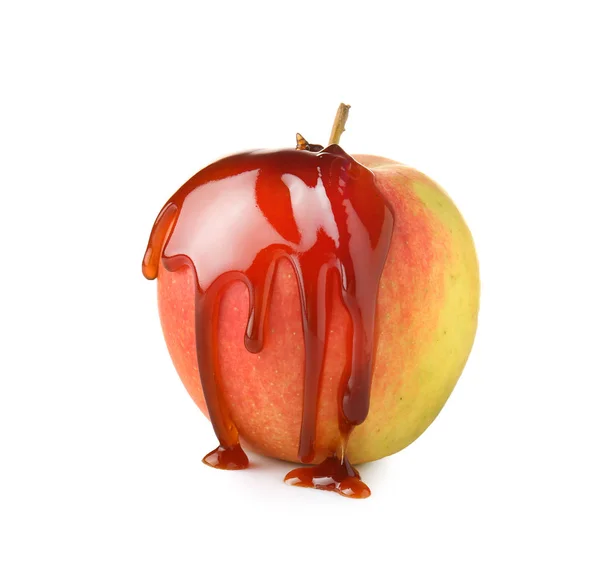Apple covered with liquid caramel on white background — Stock Photo, Image