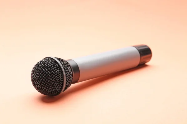 Microphone on color background — Stock Photo, Image