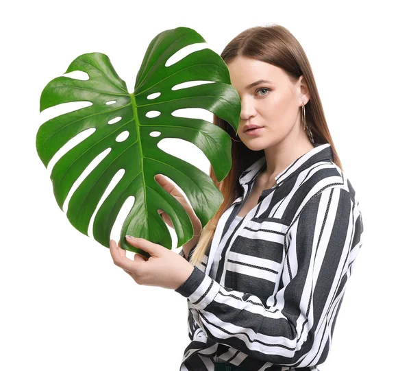 Portrait of beautiful woman with green tropical leaf on white background — Stock Photo, Image