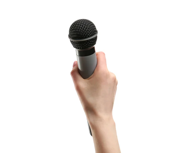 Mano femminile con microfono su sfondo bianco — Foto Stock