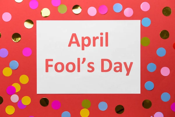 Paper sheet with text APRIL FOOL'S DAY on color background — Stock Photo, Image