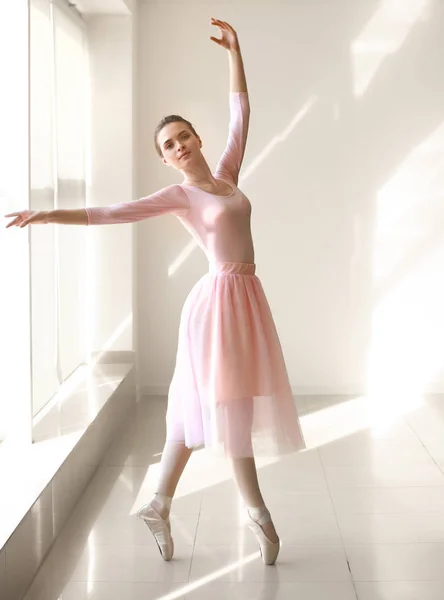 Beautiful young ballerina in dance studio — Stock Photo, Image