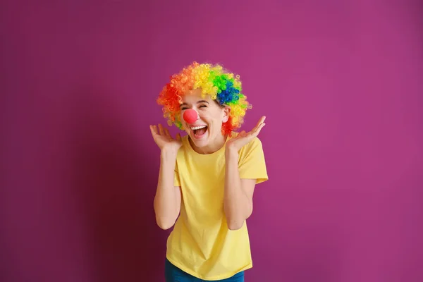 Funny woman with party decor for April Fools' Day on color background — Stock Photo, Image