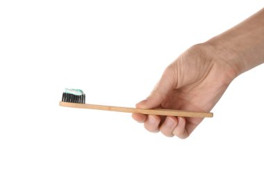 El ile diş macunu fırça beyaz arka plan üzerinde