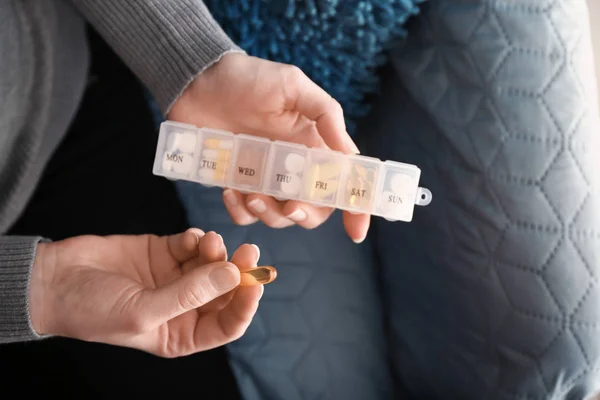 Woman holding container with pills, closeup — Stock Photo, Image