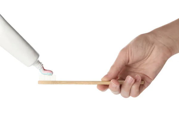 Squeezing of paste on toothbrush against white background — Stock Photo, Image