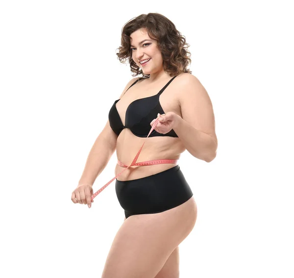 Happy plus size mulher medindo sua cintura em fundo branco. Conceito de corpo positivo — Fotografia de Stock