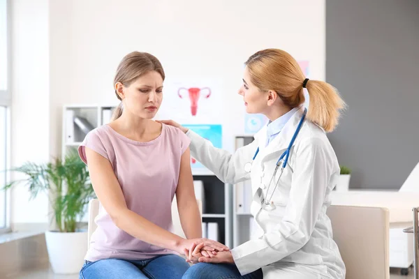 Gynecologist calming young patient in office — Stock Photo, Image