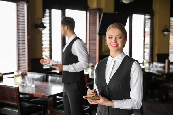 Young waiters in restaurant — Stock Photo, Image