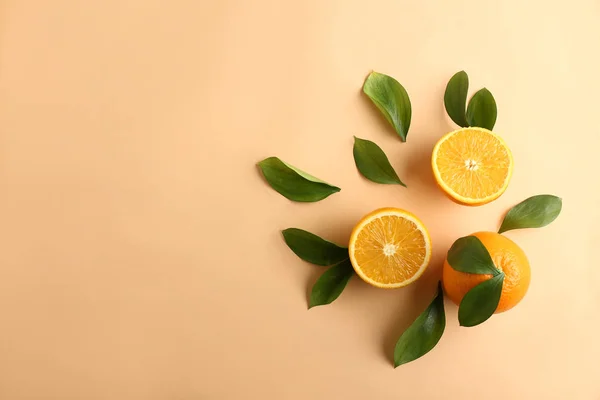Composition with fresh oranges on color background — Stock Photo, Image