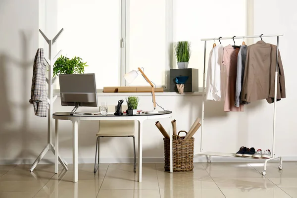 Stylish tailor's workplace in interior of workshop — Stock Photo, Image