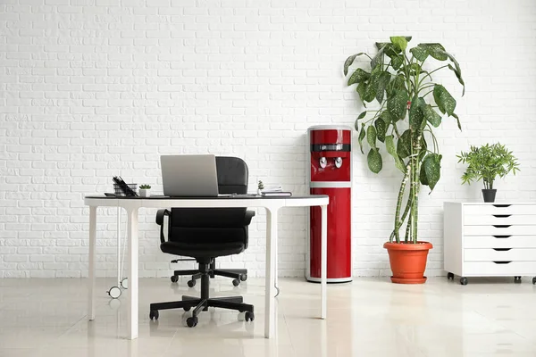 Modern water cooler in interior of business office