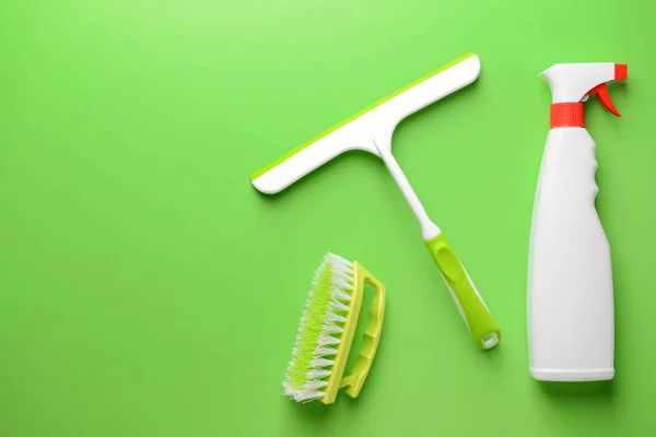 Set of cleaning supplies on color background — Stock Photo, Image