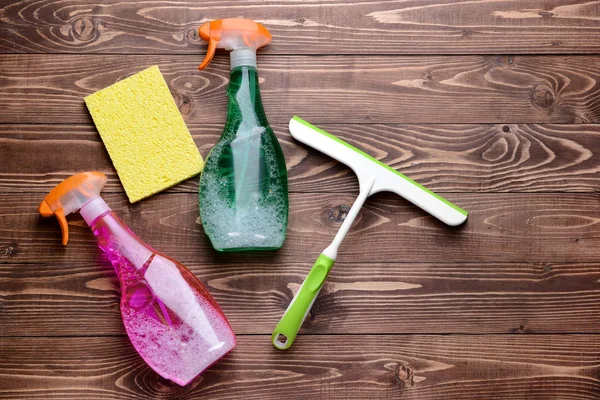 Set of cleaning supplies on wooden background — Stock Photo, Image