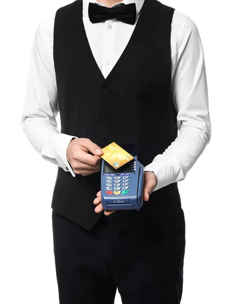 Handsome waiter with payment terminal and credit card on white background — Stock Photo, Image