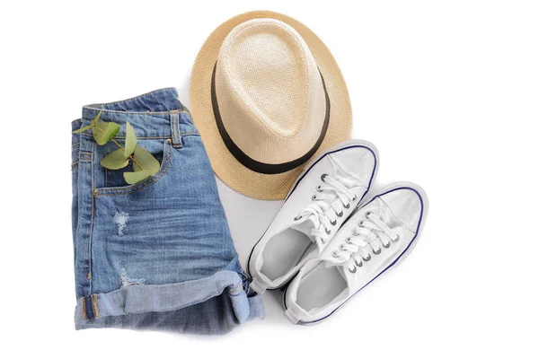 Hat with sneakers and shorts on white background — Stock Photo, Image