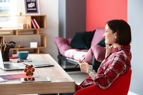 Female designer working in office — Stock Photo, Image