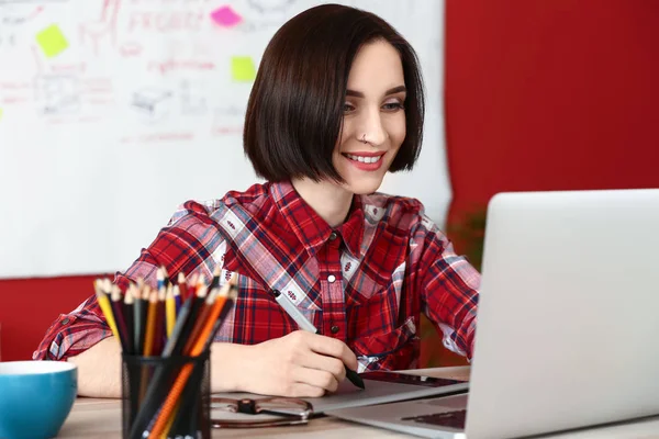 Female interior designer working in office — Stock Photo, Image