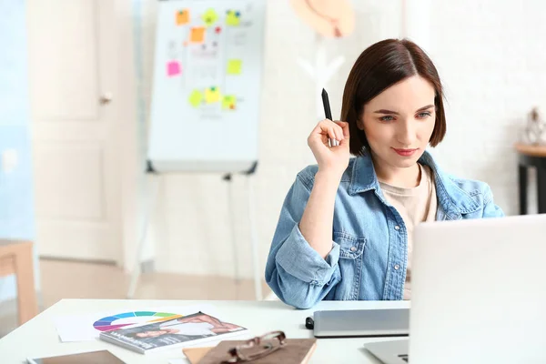 Female designer working in office — Stock Photo, Image