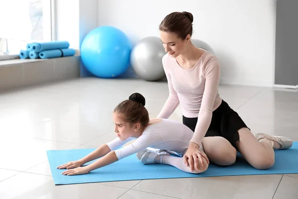 Little ballerina training with coach in dance studio — Stock Photo, Image