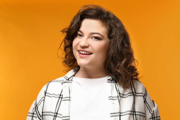 Portrait of overweight woman on color background
