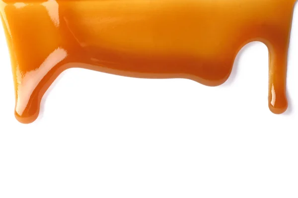 Stains of liquid caramel on white background — Stock Photo, Image