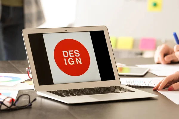 Modern laptop on table of IT designer in office — Stock Photo, Image