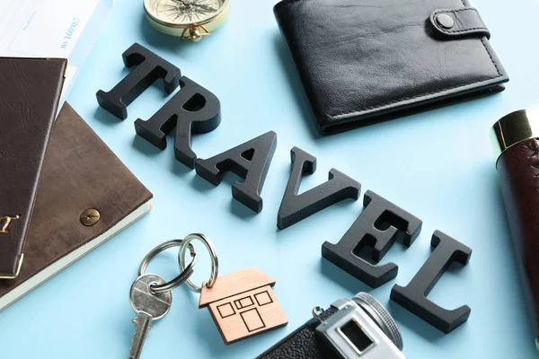 Word TRAVEL, wallet, documents and key on color background — Stock Photo, Image