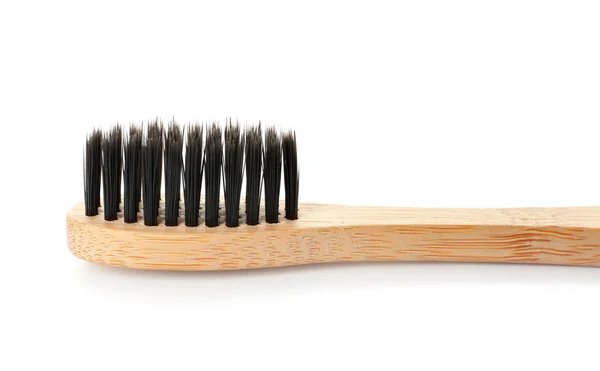 Escova de dentes de madeira no fundo branco — Fotografia de Stock