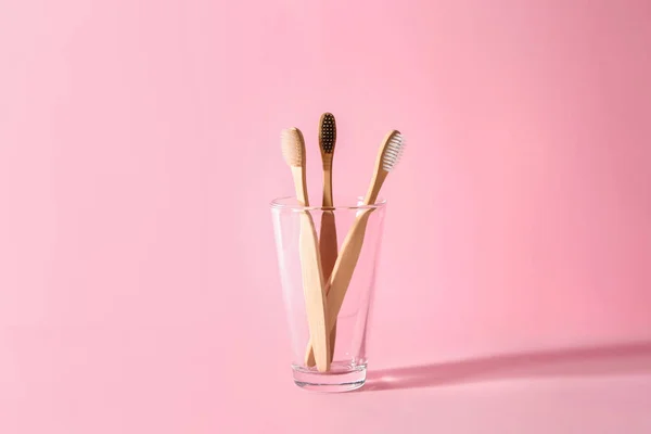 Holder with toothbrushes on color background — Stock Photo, Image