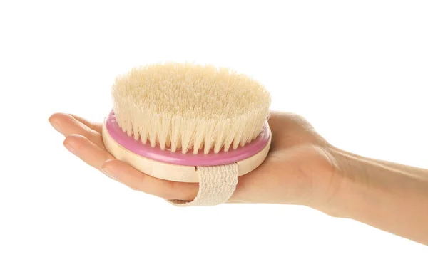 Female hand with massage brush on white background — Stock Photo, Image