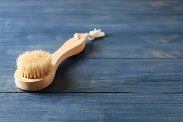 Massage brush on wooden background — Stock Photo, Image