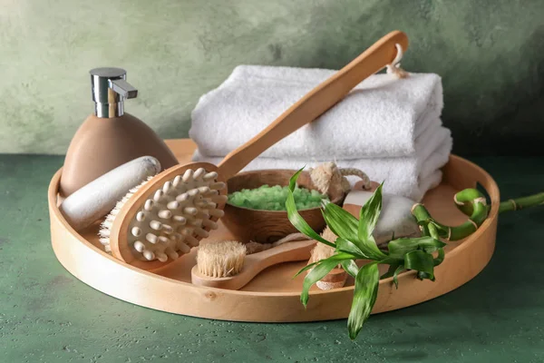 Tray with massage brushes, cosmetics and towels on table — Stock Photo, Image